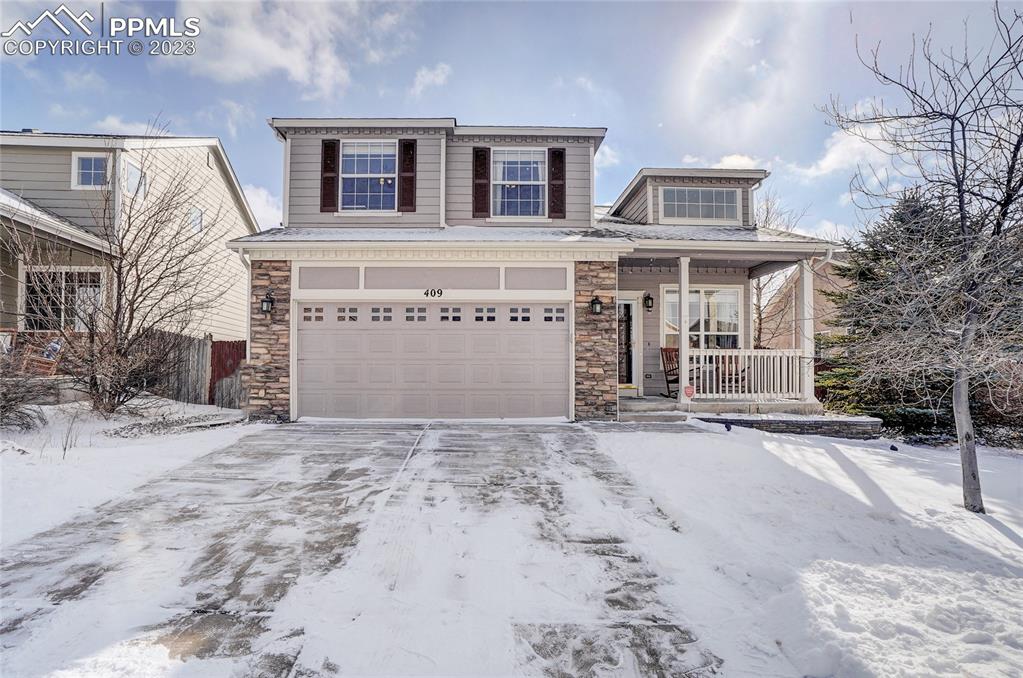 409 Avocet Loop Colorado Springs, CO 80921 - Photo 2 of 34 a view of a house with a snow in the background