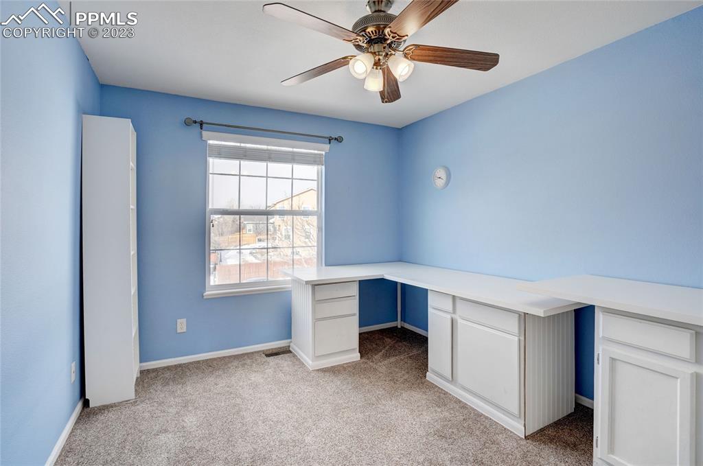 409 Avocet Loop Colorado Springs, CO 80921 - Photo 24 of 34 a view of an empty room with a window