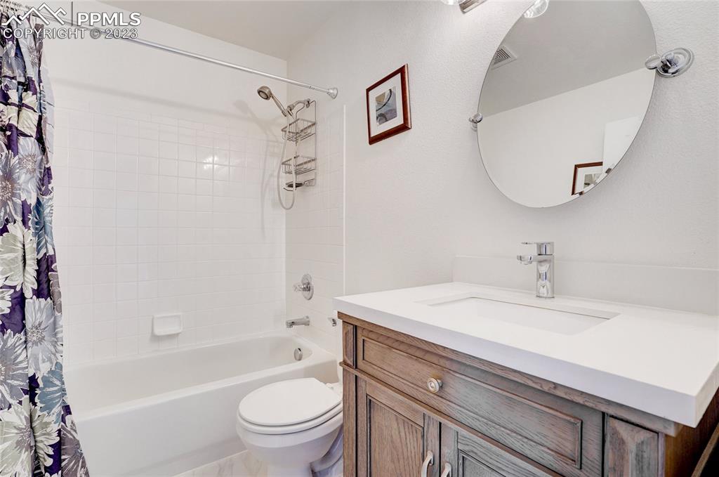 409 Avocet Loop Colorado Springs, CO 80921 - Photo 28 of 34 a bathroom with a sink toilet and shower