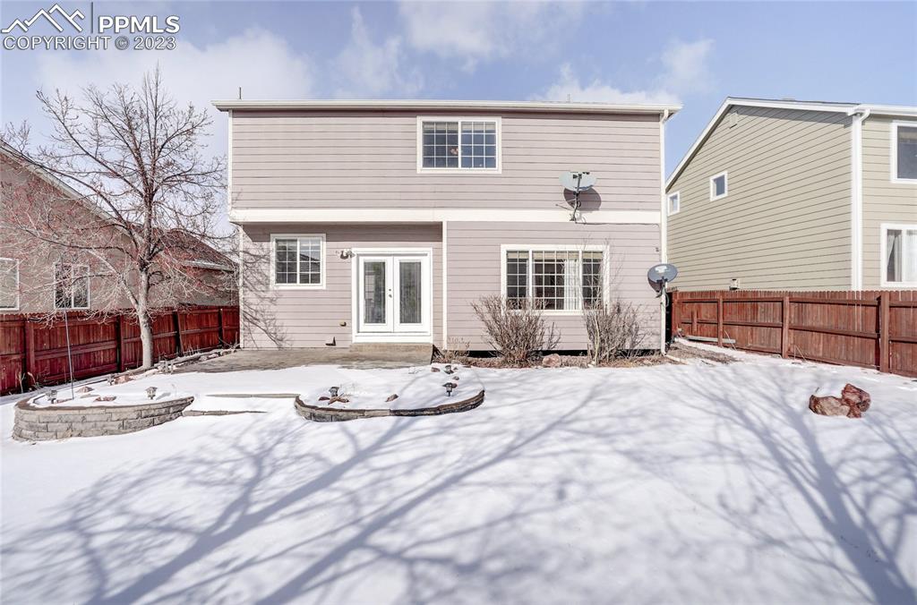 409 Avocet Loop Colorado Springs, CO 80921 - Photo 30 of 34 a view of a house with snow on the side of the road