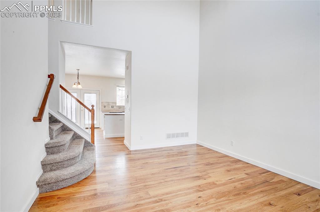 409 Avocet Loop Colorado Springs, CO 80921 - Photo 5 of 34 a view of entryway and hall with wooden floor