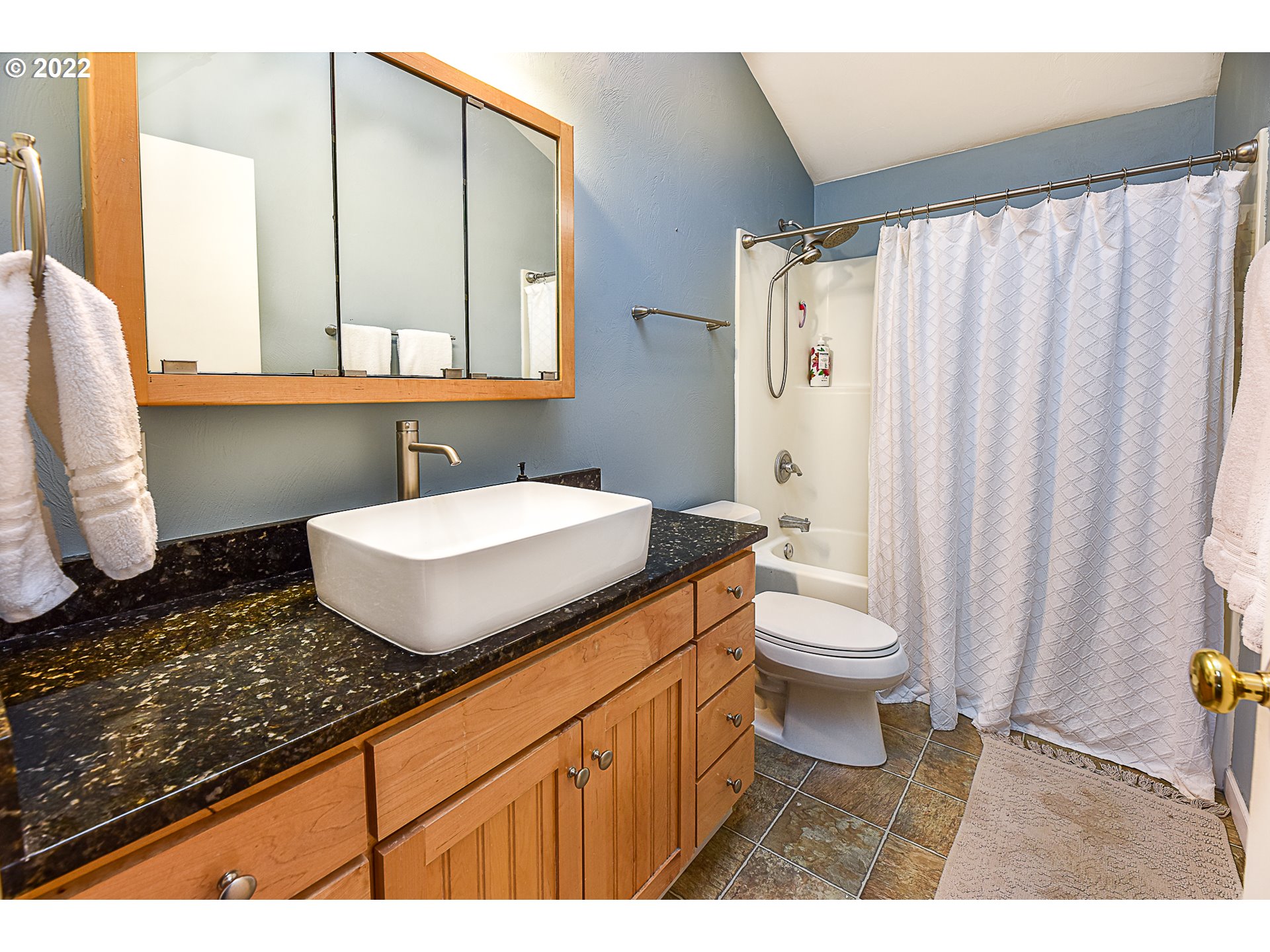 3241 Pheasant Boulevard Springfield, OR 97477 - Photo 18 of 28 a bathroom with a granite countertop sink mirror vanity and toilet