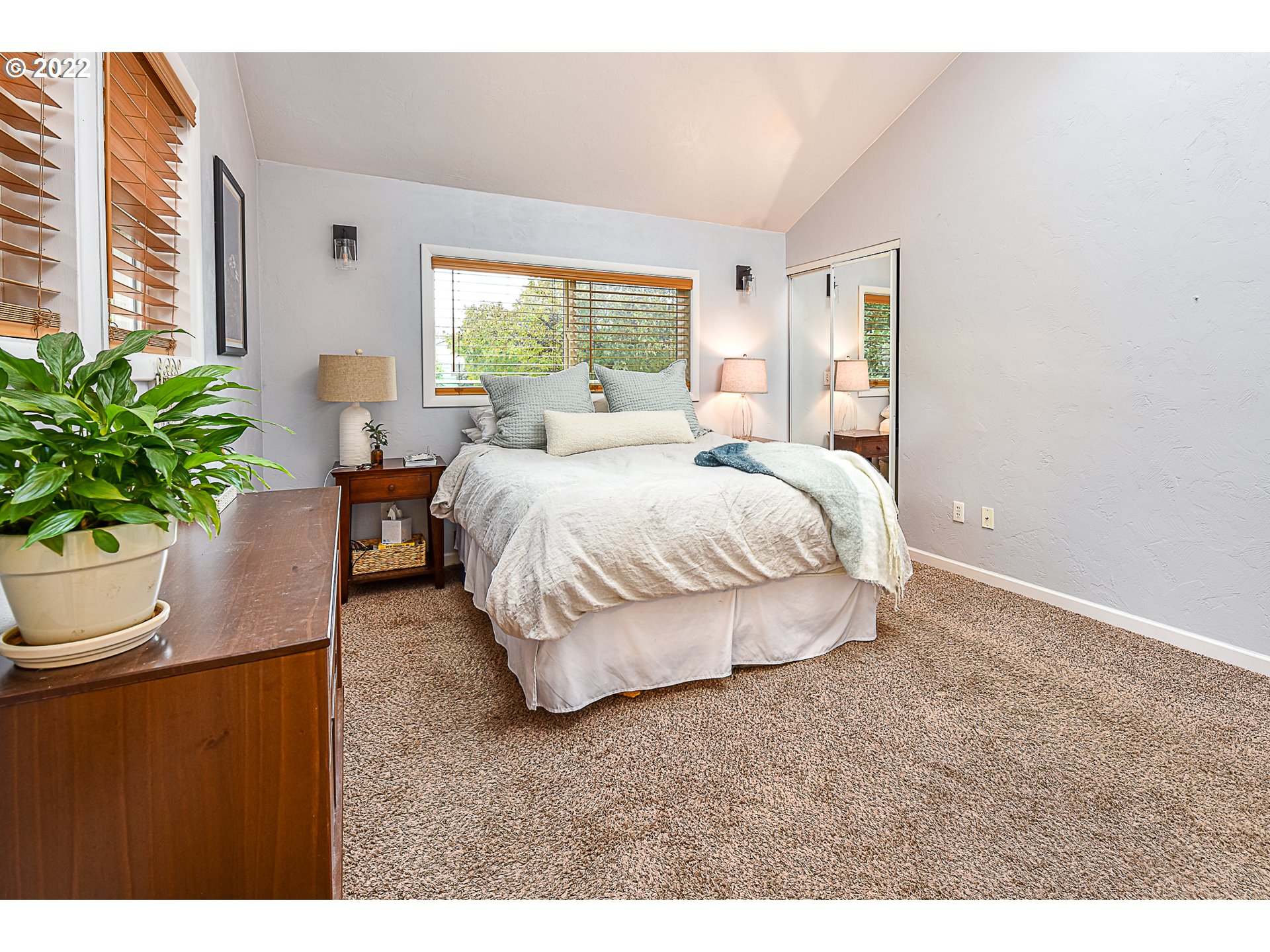 3241 Pheasant Boulevard Springfield, OR 97477 - Photo 19 of 28 a bedroom with a bed lamp and window