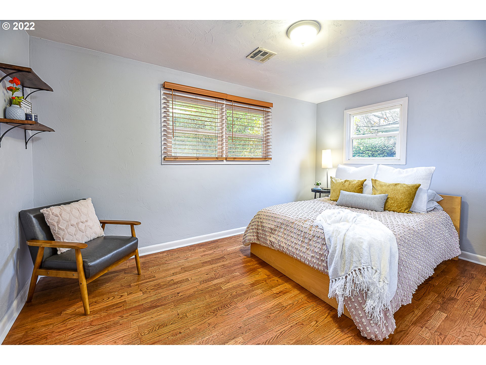 3241 Pheasant Boulevard Springfield, OR 97477 - Photo 20 of 28 a bed sitting in a bedroom next to a window