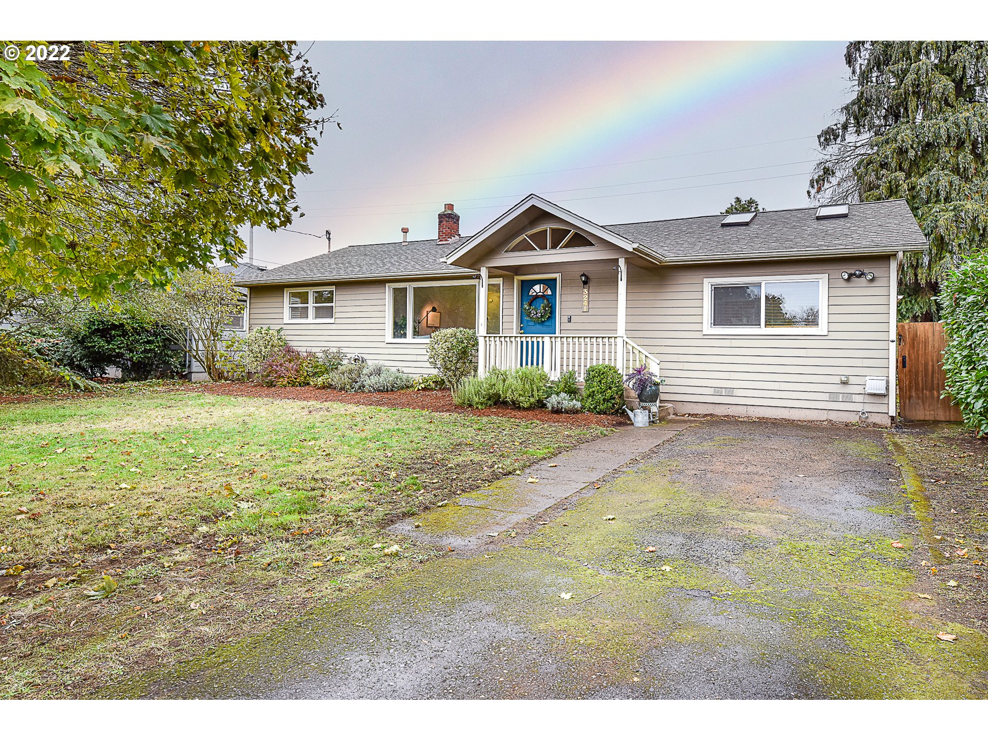 3241 Pheasant Boulevard Springfield, OR 97477 - Photo 2 of 28 a view of a yard in front of a house with large trees