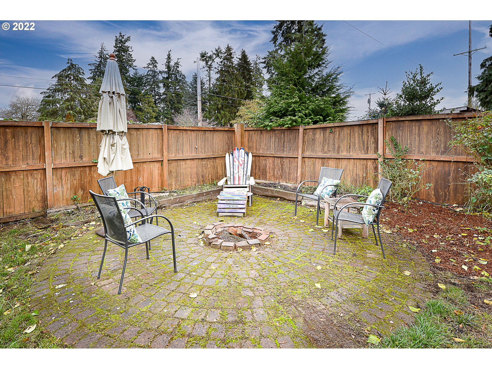 3241 Pheasant Boulevard Springfield, OR 97477 - Photo 26 of 28 a view of a chairs and tables in the back yard of the house