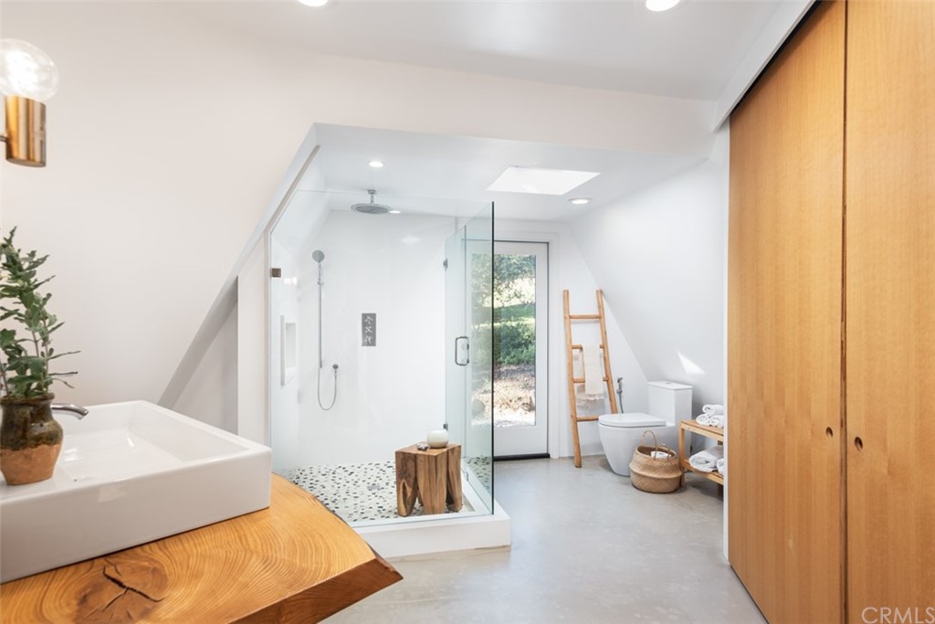 4935 San Jacinto Circle East Fallbrook, CA 92028 - Photo 20 of 53 a spacious bedroom with a bed and a couch