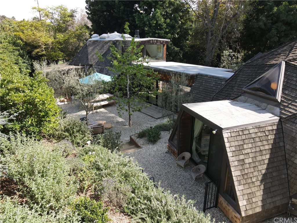 4935 San Jacinto Circle East Fallbrook, CA 92028 - Photo 53 of 53 a view of a patio with table and chairs under an umbrella with large trees