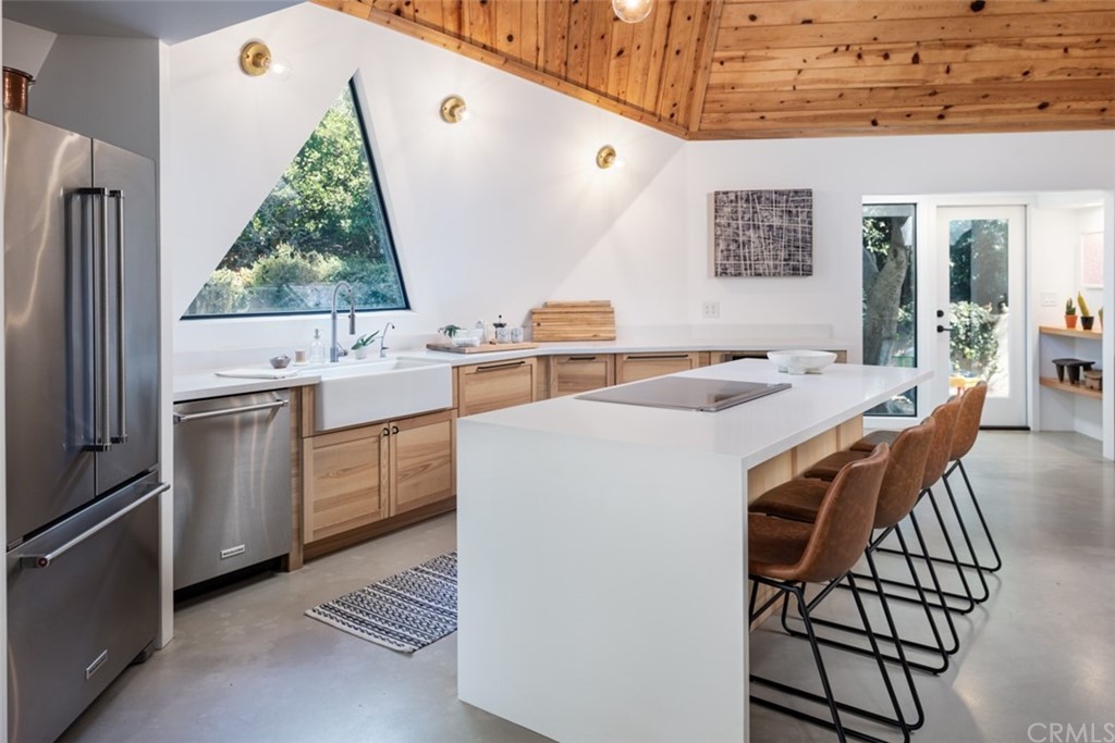 4935 San Jacinto Circle East Fallbrook, CA 92028 - Photo 7 of 53 a open kitchen with a sink a stove and a refrigerator