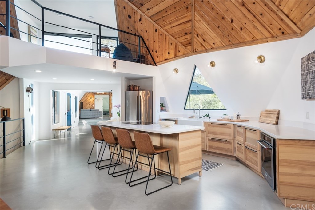 4935 San Jacinto Circle East Fallbrook, CA 92028 - Photo 8 of 53 a kitchen with a sink cabinets and wooden floor