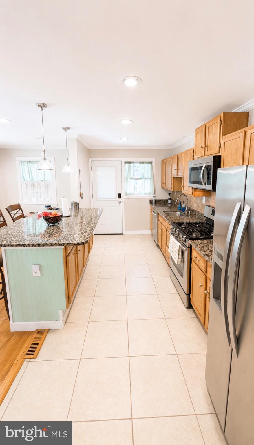 8027 Park Haven Road Dundalk, MD 21222 - Photo 8 of 13 Bright and inviting modern kitchen.
Edit with AI