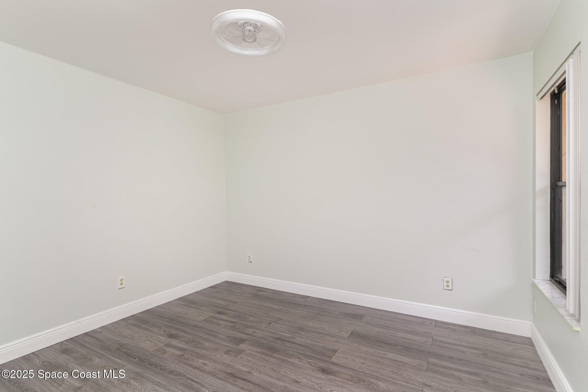1040 Abada Court Northeast, Unit 109 Palm Bay, FL 32905 - Photo 15 of 25 a view of a room with wooden floor