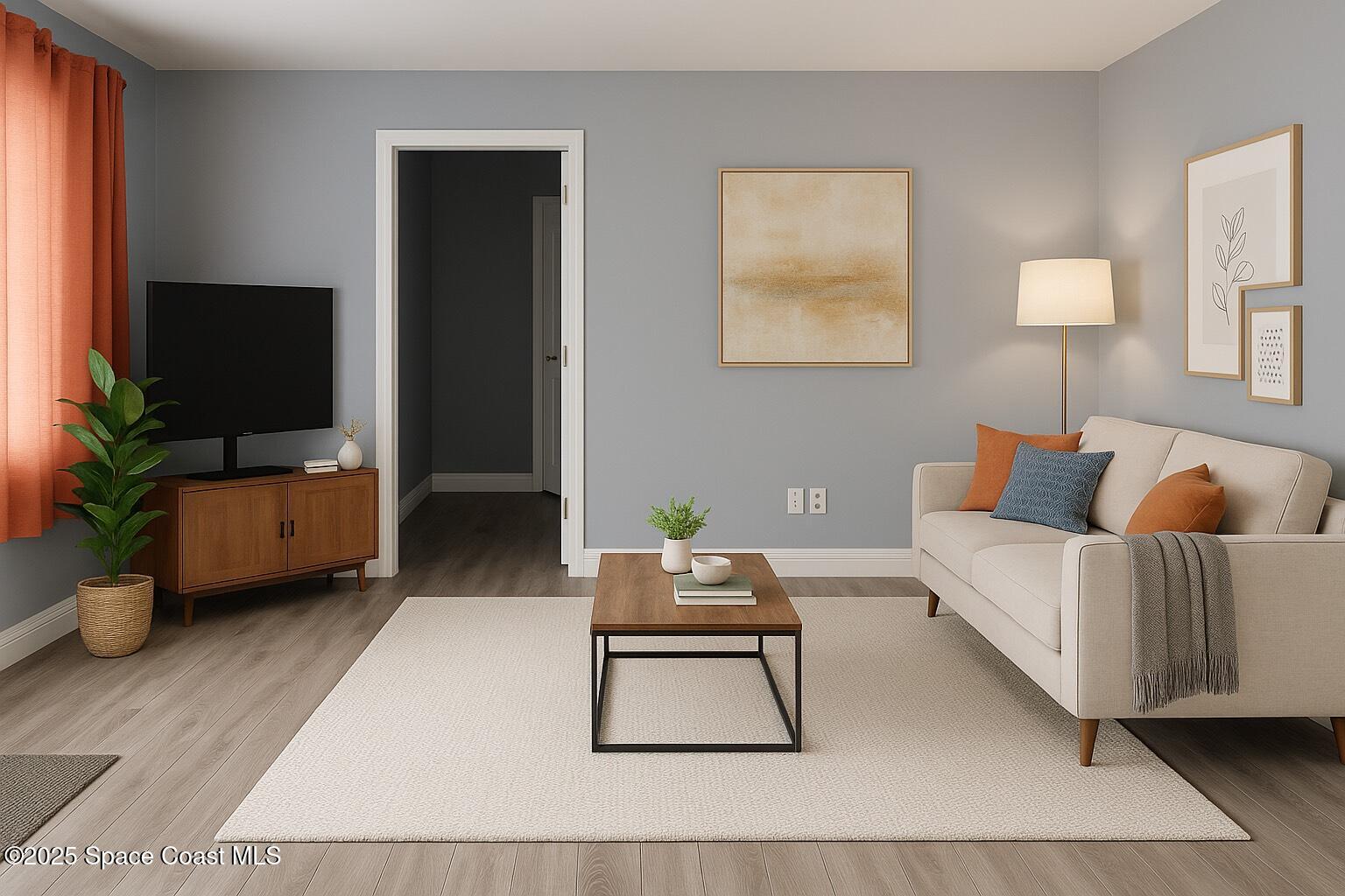 1040 Abada Court Northeast, Unit 109 Palm Bay, FL 32905 - Photo 4 of 25 a living room with furniture and a flat screen tv