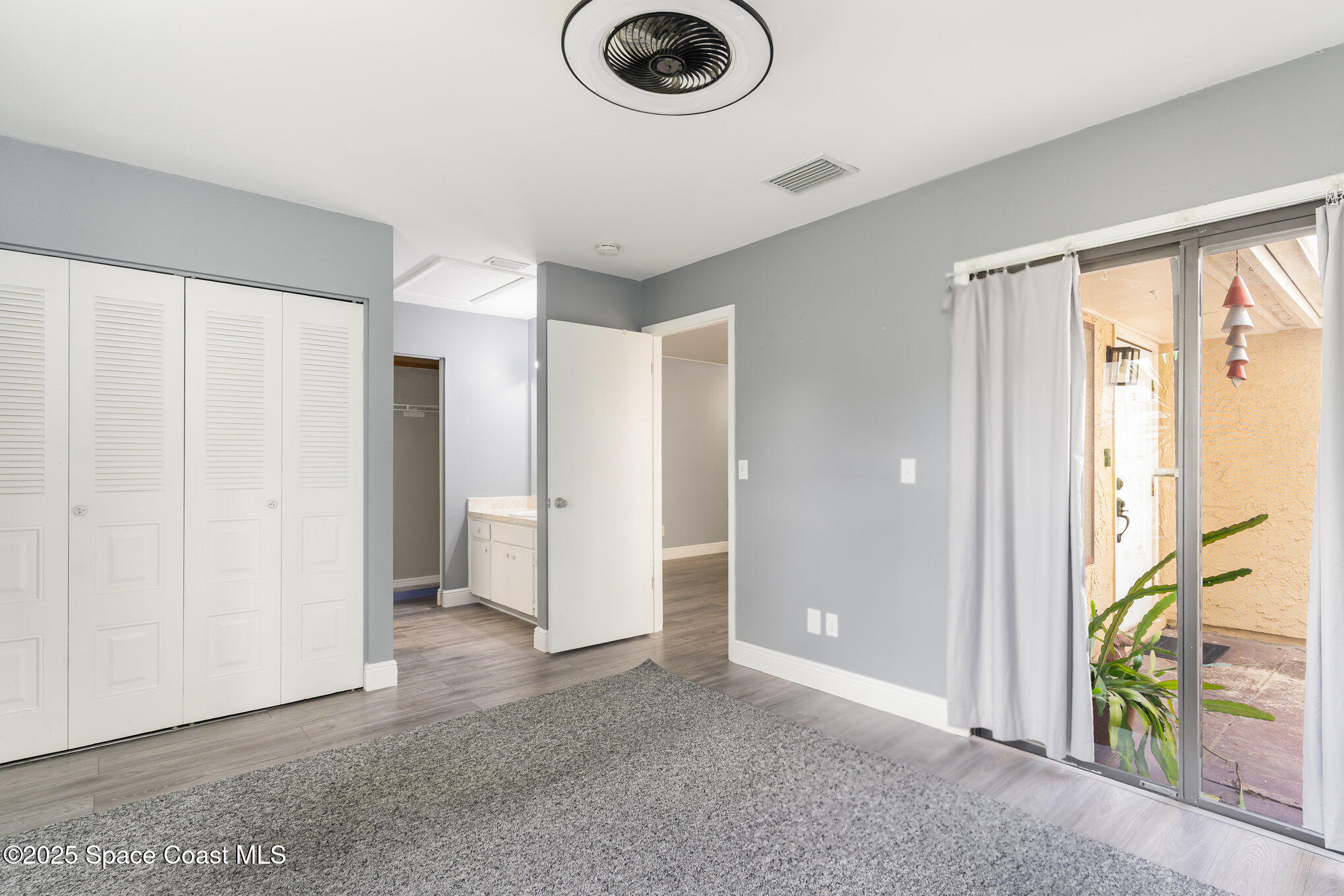 1040 Abada Court Northeast, Unit 109 Palm Bay, FL 32905 - Photo 5 of 25 a view of kitchen and front door