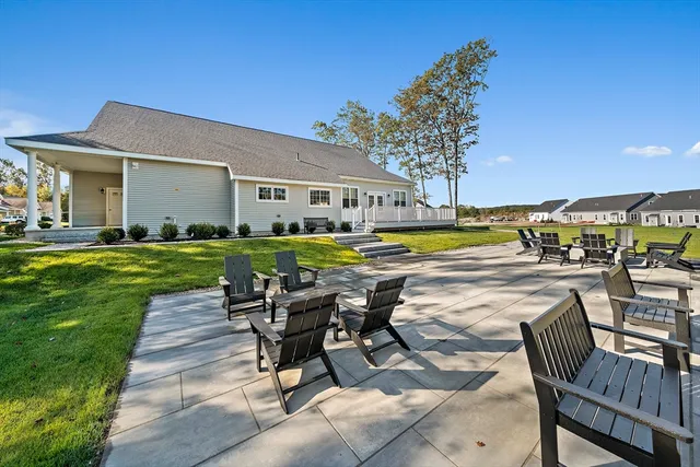 a view of a swimming pool and lounge chair