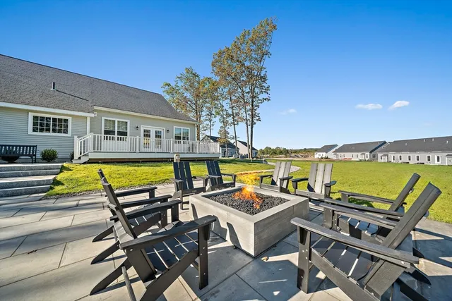 a view of a backyard with sitting area