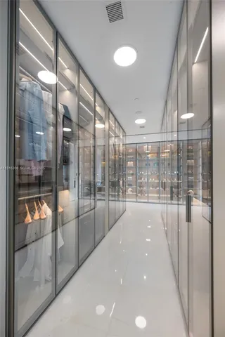 a bathroom with a double vanity sink toilet and mirror
