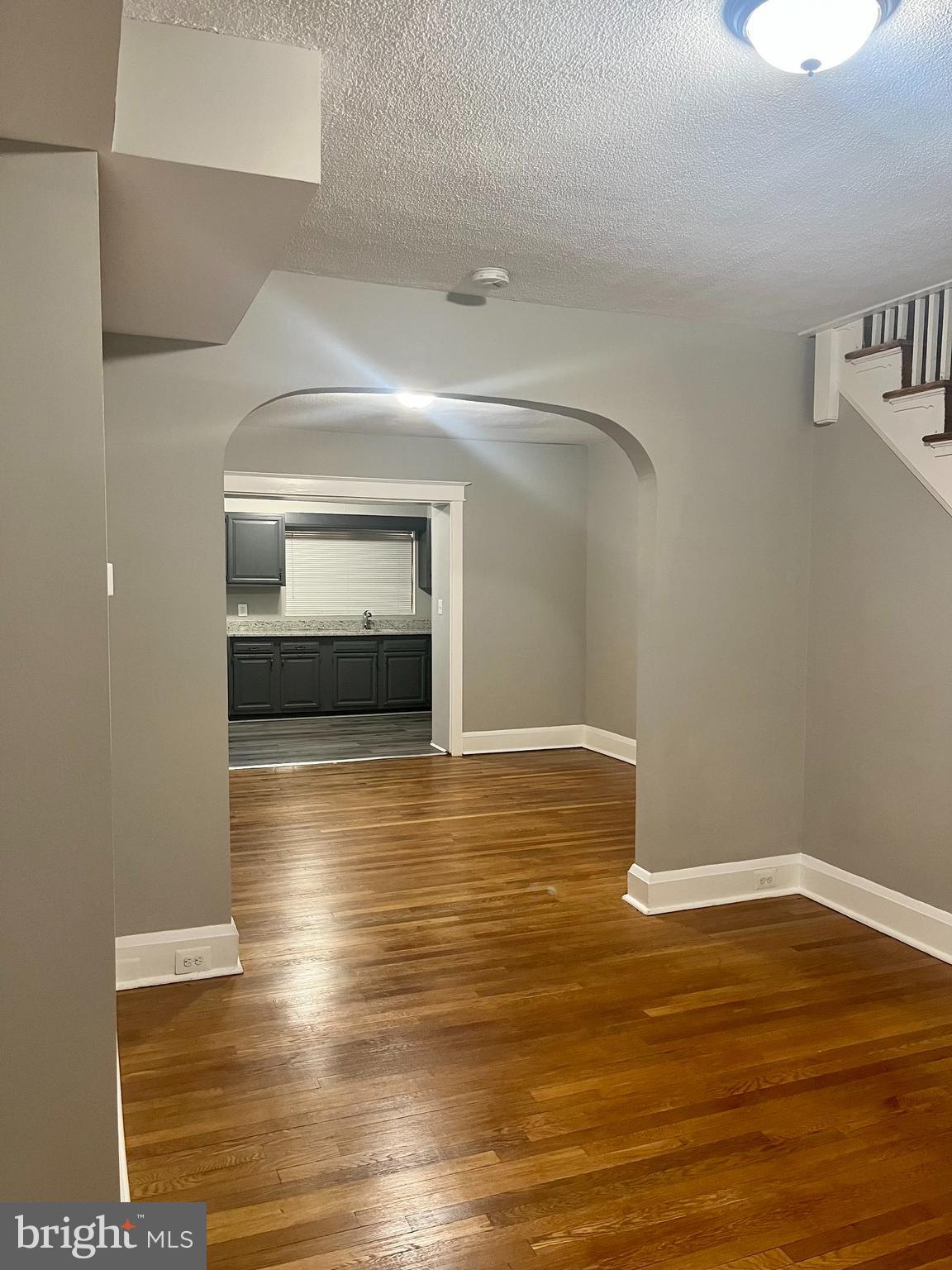133 North Monastery Avenue Baltimore, MD 21229 - Photo 1 of 29 a view of empty room with wooden floor