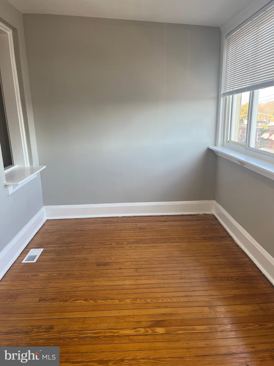 133 North Monastery Avenue Baltimore, MD 21229 - Photo 15 of 29 wooden floor in an empty room