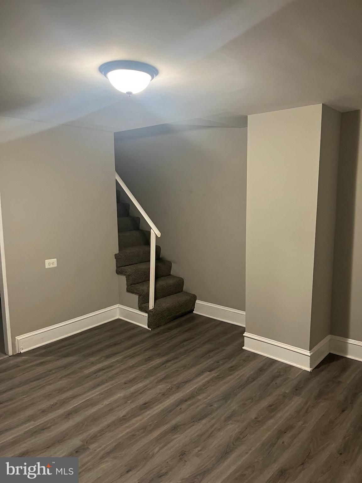 133 North Monastery Avenue Baltimore, MD 21229 - Photo 24 of 29 a view of an empty room with wooden floor