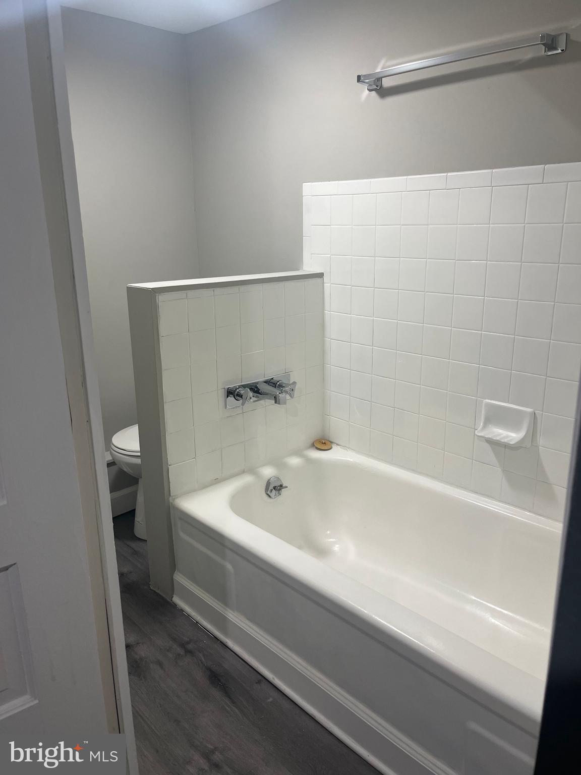 133 North Monastery Avenue Baltimore, MD 21229 - Photo 27 of 29 a bathroom with a bathtub and a toilet