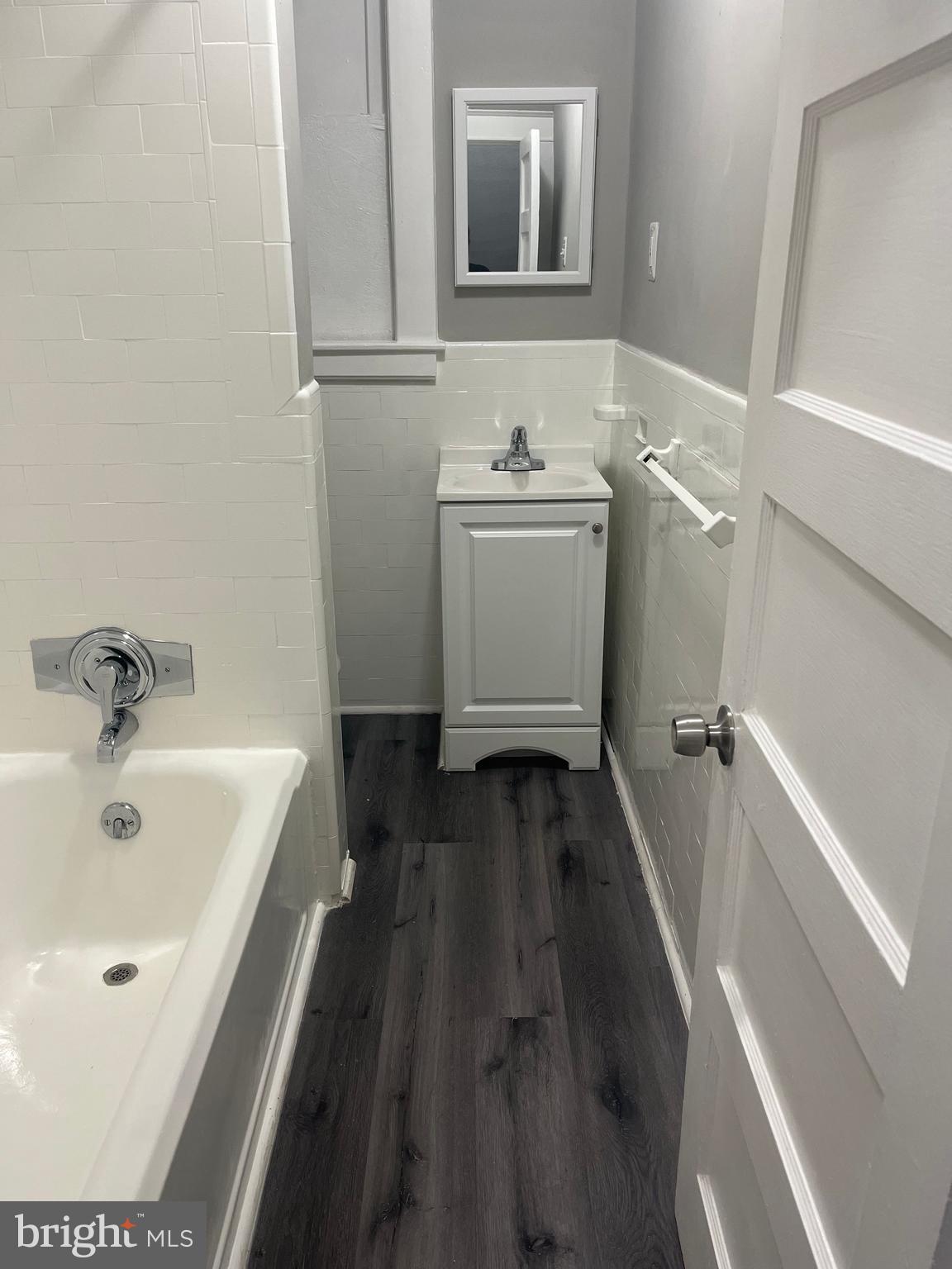 133 North Monastery Avenue Baltimore, MD 21229 - Photo 9 of 29 a bathroom with a sink and a bathtub