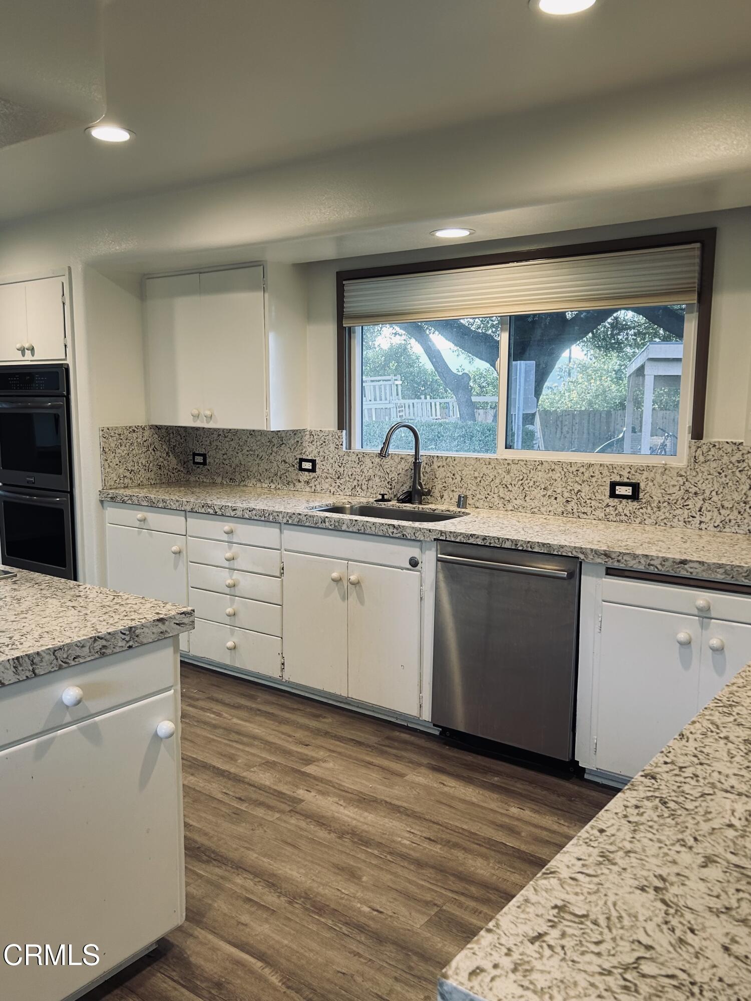 9630 Santa Rosa Road Camarillo, CA 93012 - Photo 15 of 35 a kitchen with a sink stove and cabinets