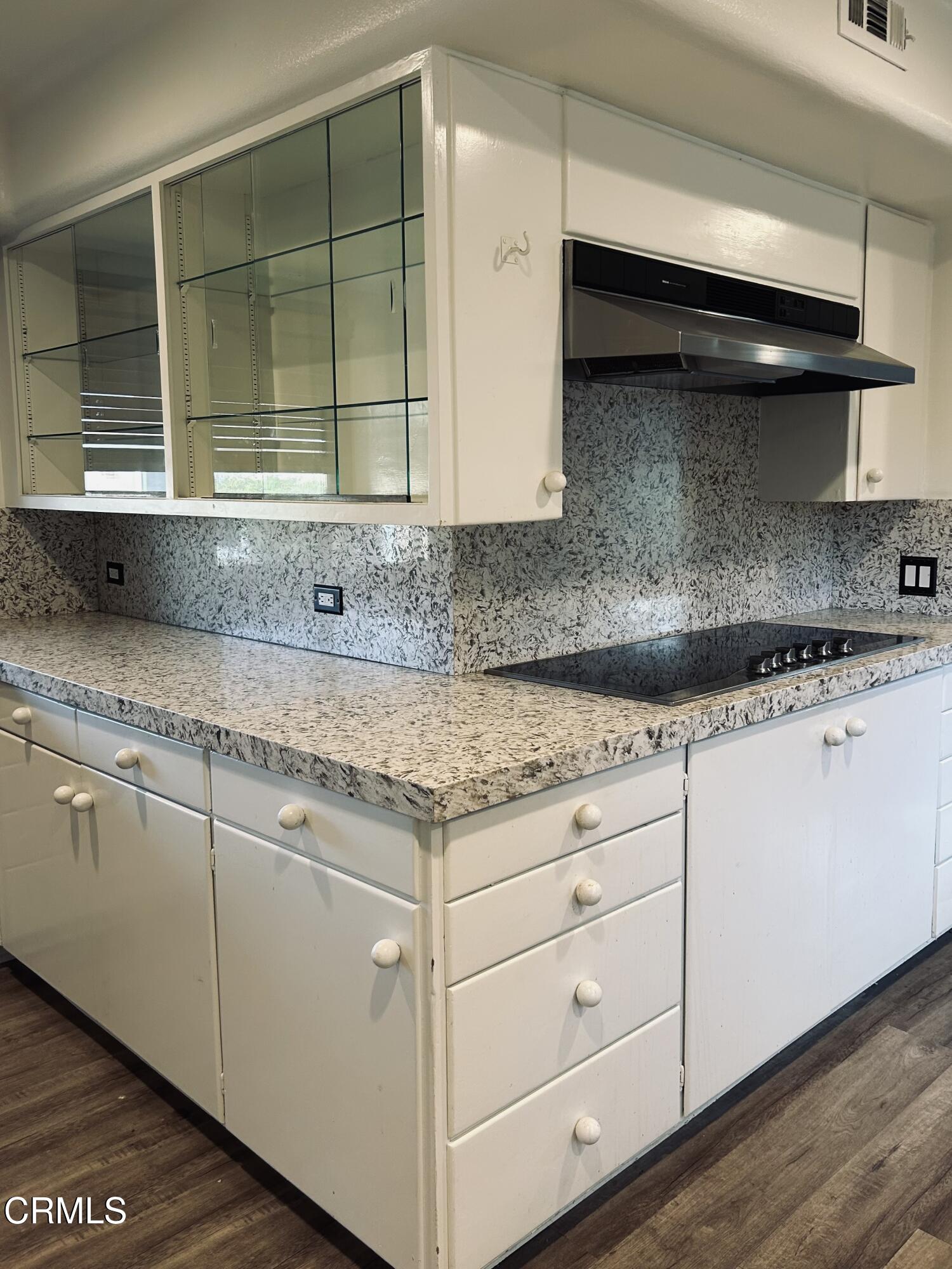9630 Santa Rosa Road Camarillo, CA 93012 - Photo 16 of 35 a kitchen with granite countertop white cabinets and a sink
