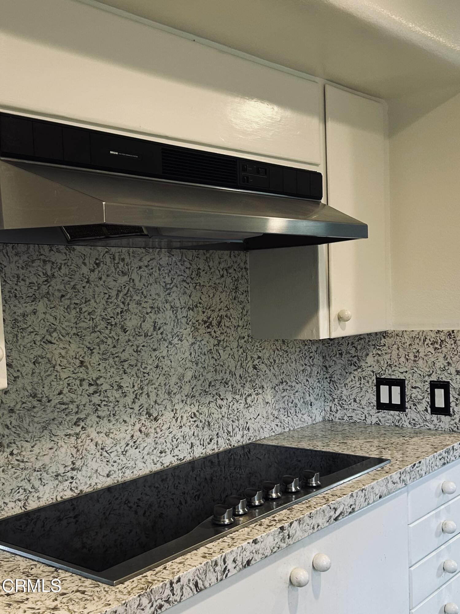 9630 Santa Rosa Road Camarillo, CA 93012 - Photo 17 of 35 a kitchen with a sink and cabinets