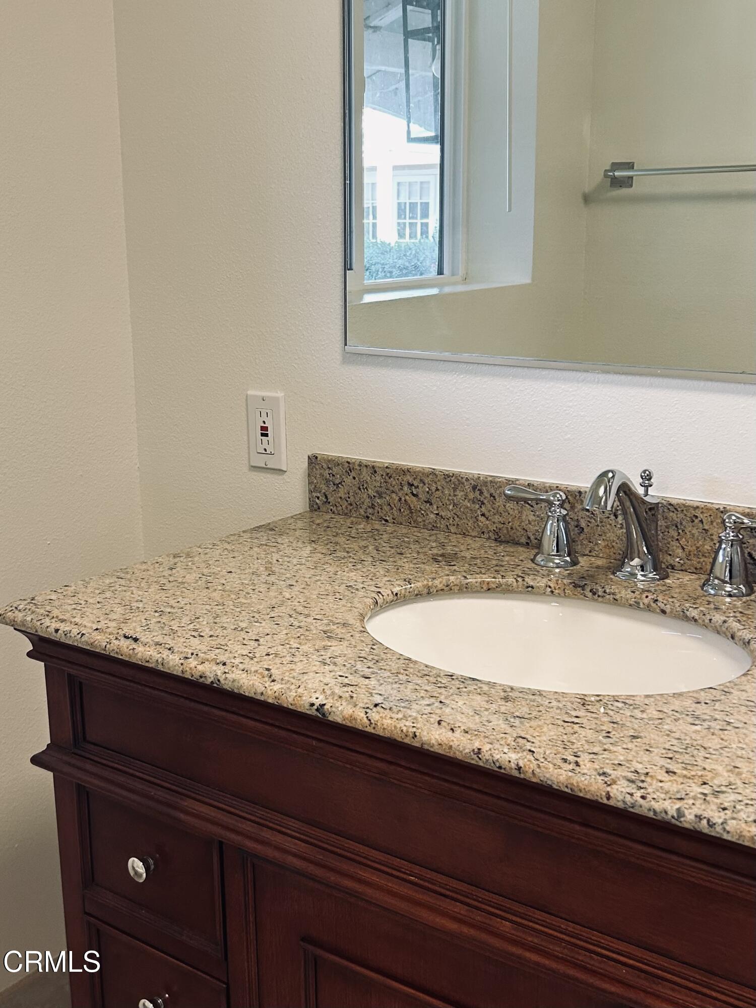 9630 Santa Rosa Road Camarillo, CA 93012 - Photo 25 of 35 a bathroom with a granite countertop sink and vanity