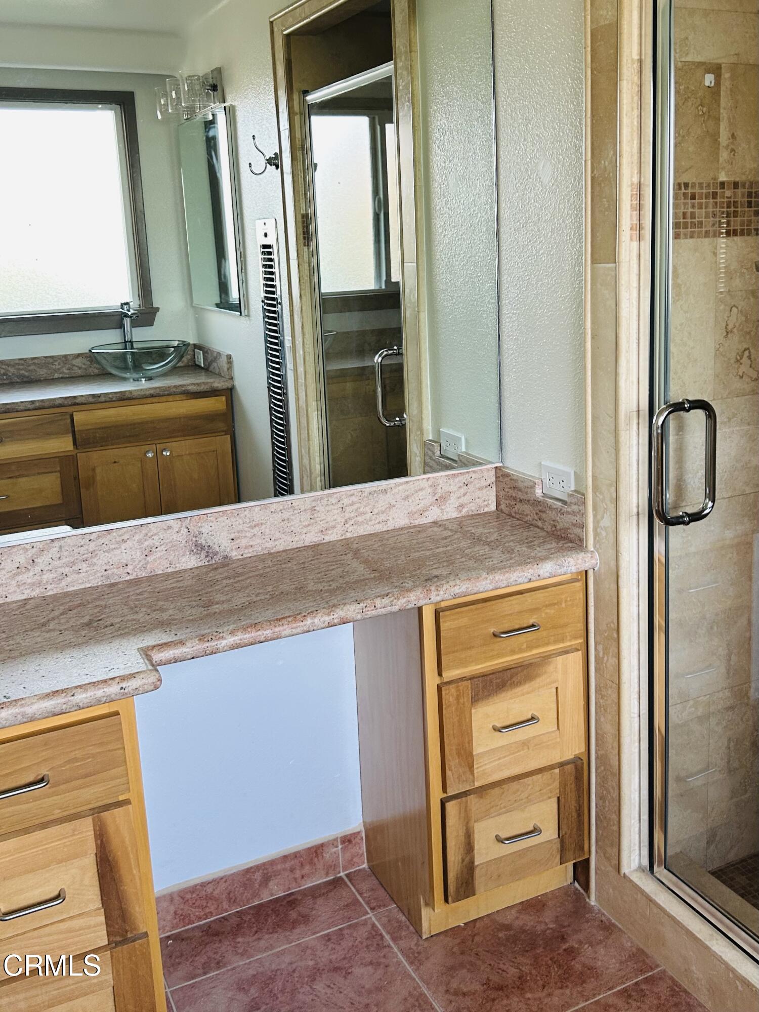 9630 Santa Rosa Road Camarillo, CA 93012 - Photo 28 of 35 a bathroom with a granite countertop sink and a mirror