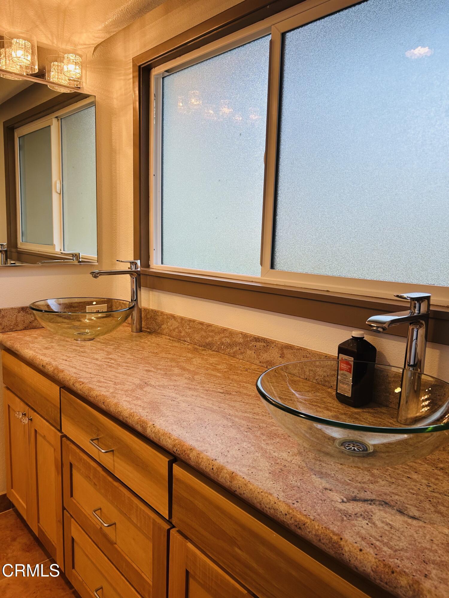 9630 Santa Rosa Road Camarillo, CA 93012 - Photo 29 of 35 a bathroom with a sink and a mirror