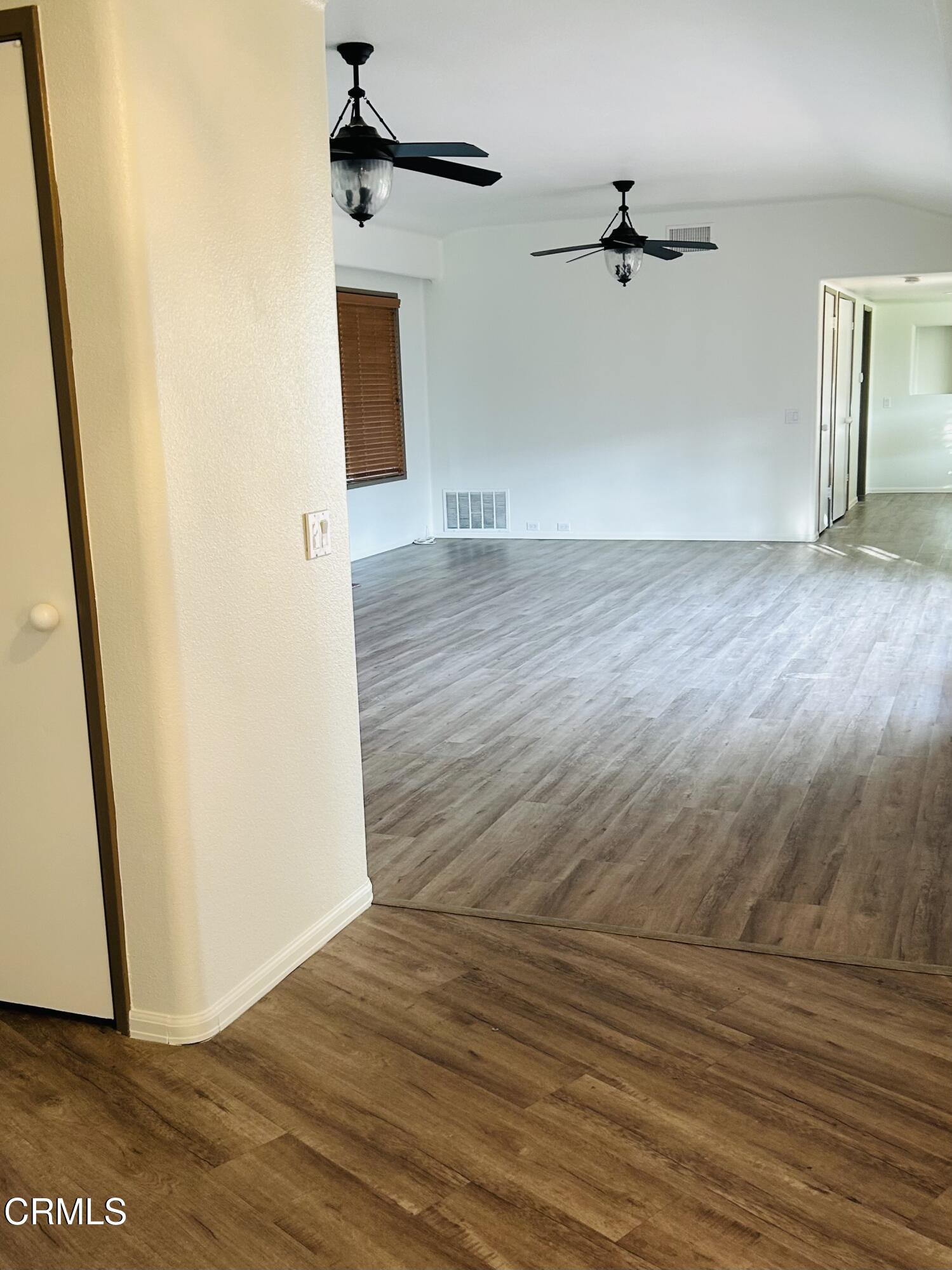 9630 Santa Rosa Road Camarillo, CA 93012 - Photo 5 of 35 a view of a hallway with wooden floor