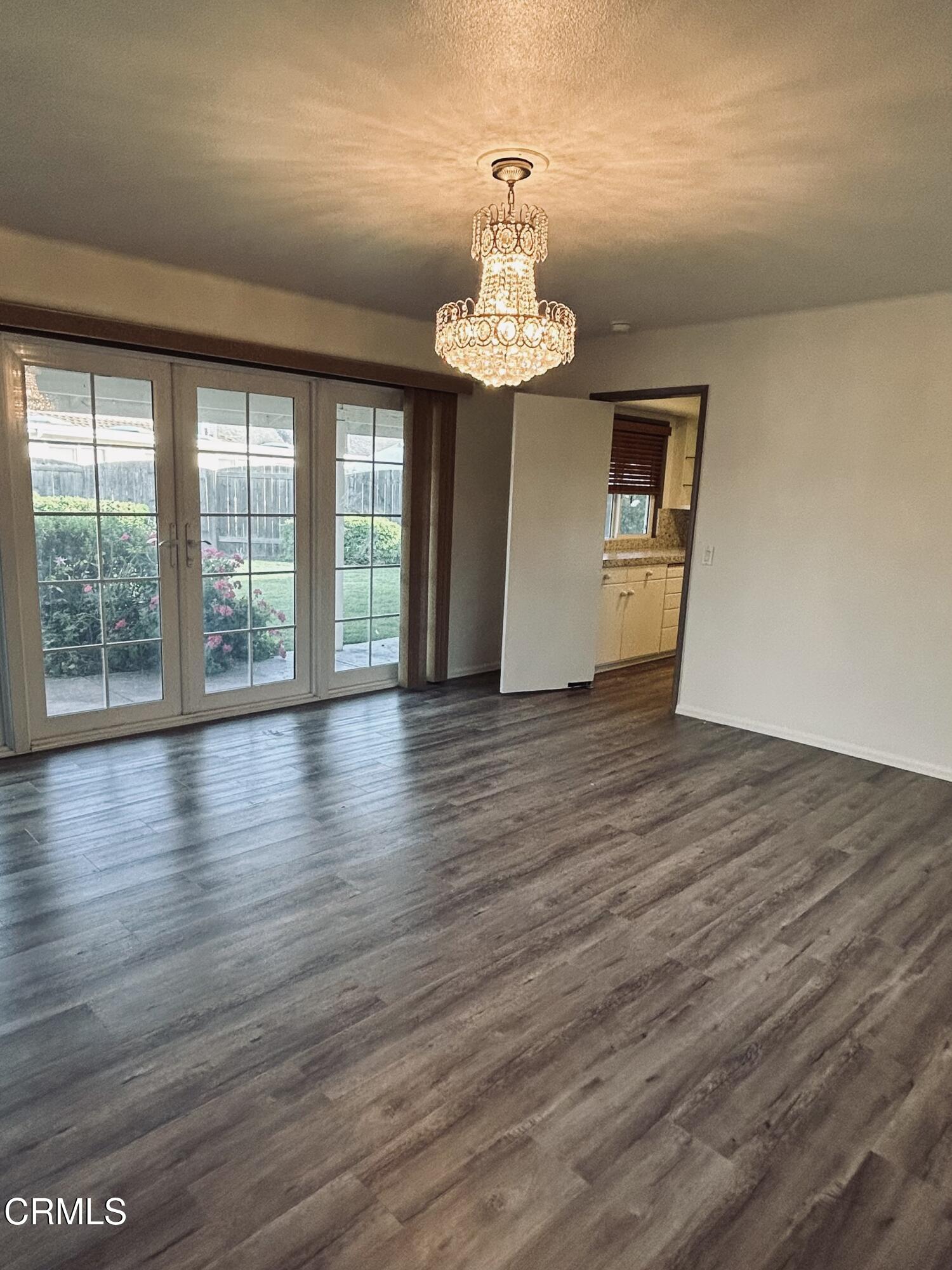 9630 Santa Rosa Road Camarillo, CA 93012 - Photo 10 of 35 a view of an empty room with wooden floor and a window