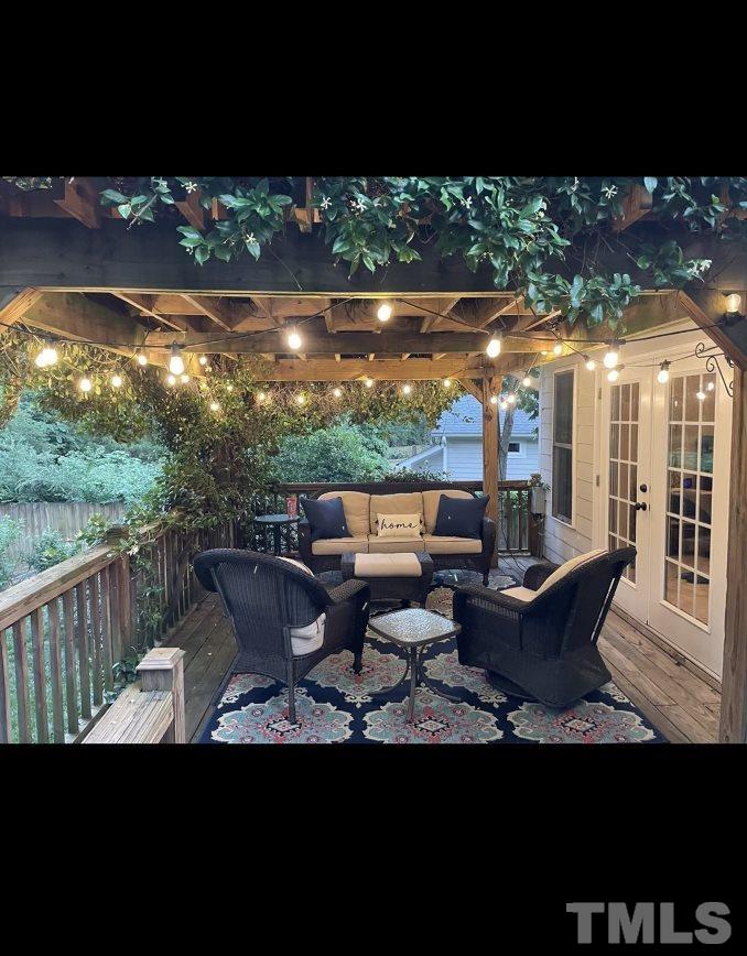 3016 Old Orchard Road Raleigh, NC 27607 - Photo 23 of 39 a view of a patio with table and chairs and floor to ceiling window