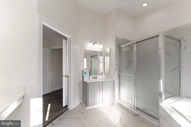 a bathroom with a shower and a sink