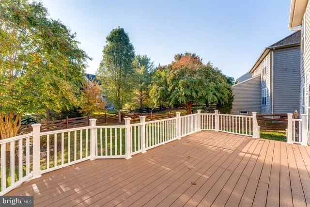 a balcony with view of trees in the background