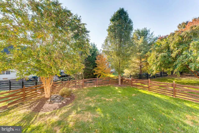 a view of a swimming pool with an outdoor space and seating area