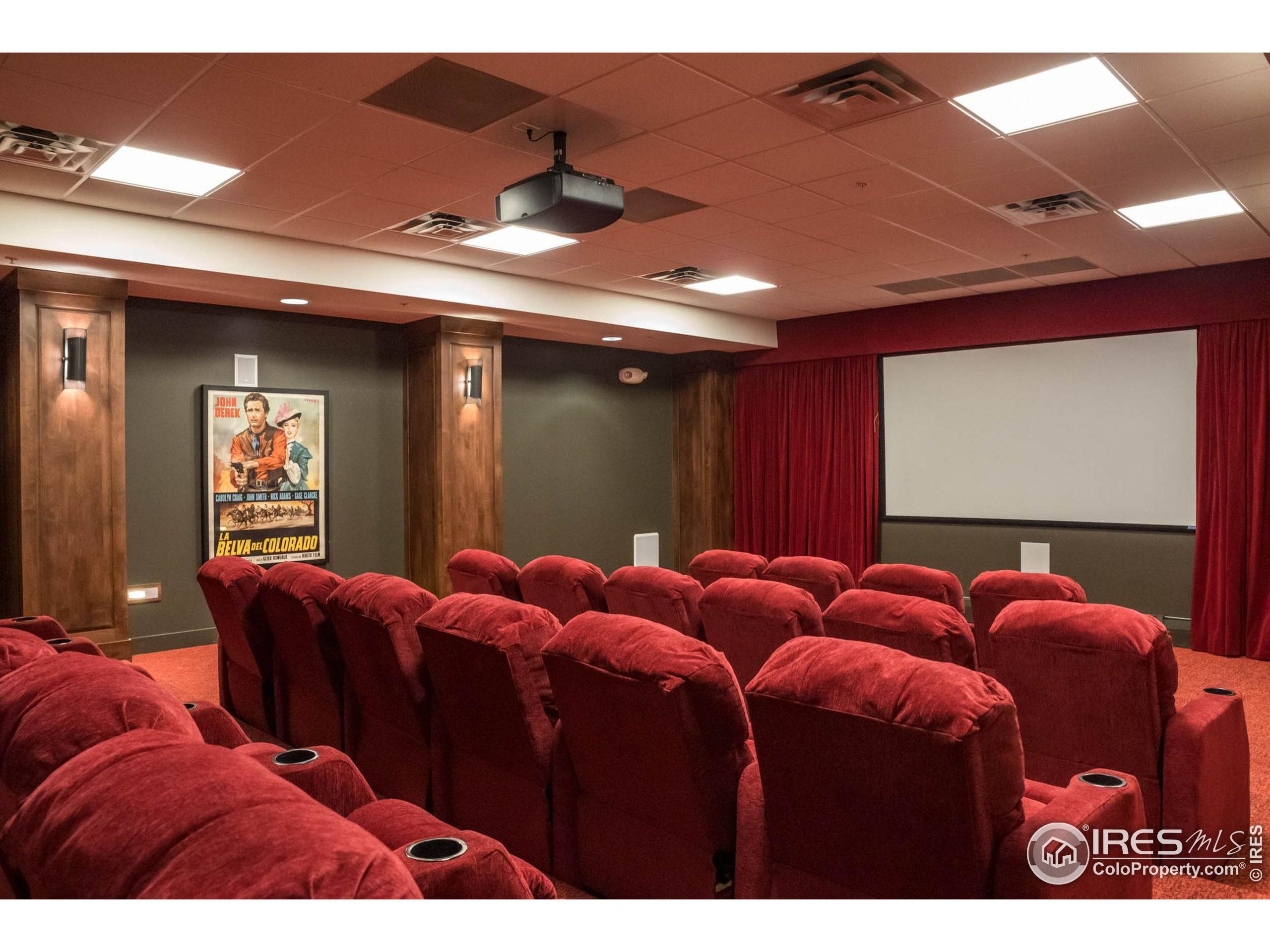 3301 Arapahoe Avenue, Unit 405 Boulder, CO 80303 - Photo 26 of 36 a media room with lots of chairs and a projector