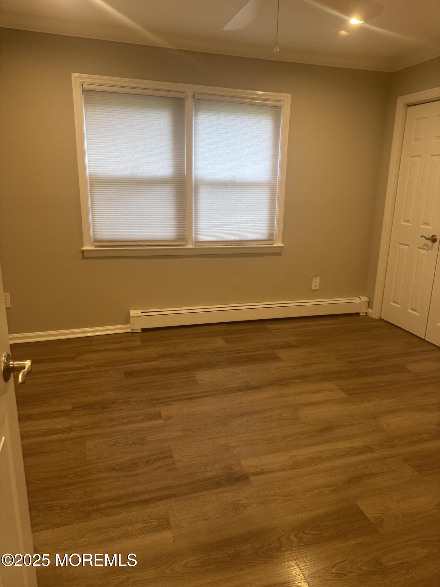 96 East Avenue, Unit 65 Atlantic Highlands, NJ 07716 - Photo 8 of 13 a view of a room with wooden floor and small window