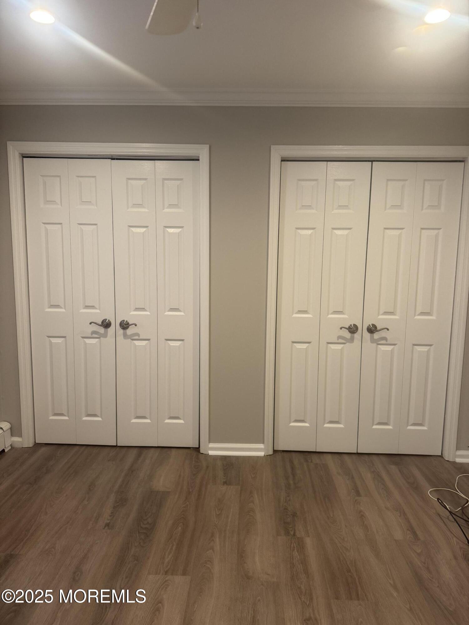 96 East Avenue, Unit 65 Atlantic Highlands, NJ 07716 - Photo 9 of 13 an empty room with wooden floor