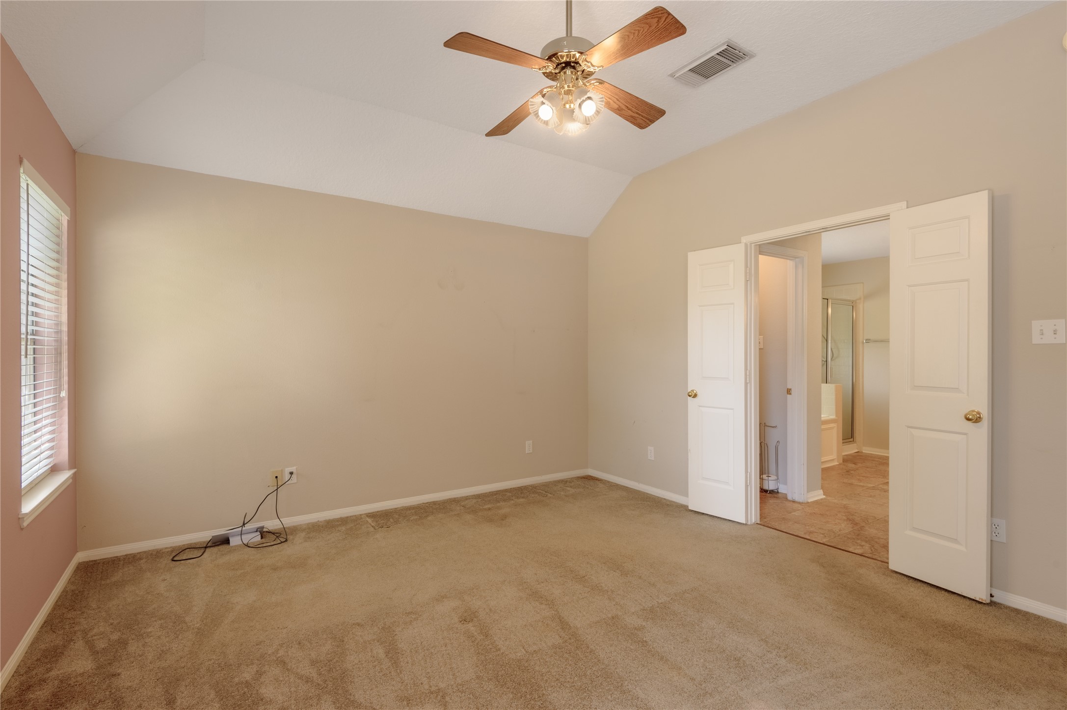 324 Red Oak Lane Trinity, TX 75862 - Photo 26 of 49 an empty room with a ceiling fan and carpet