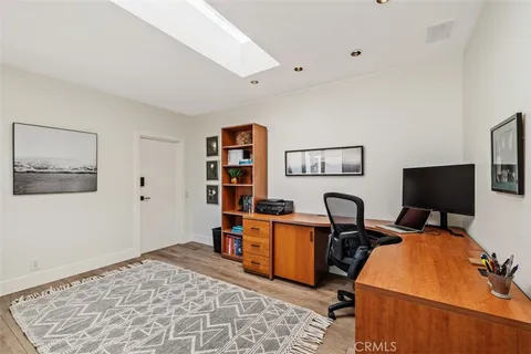 a workspace with furniture and window