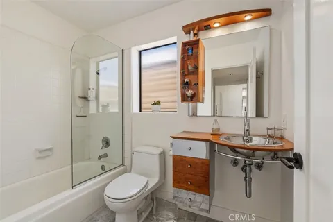 a front view of a house with outdoor seating