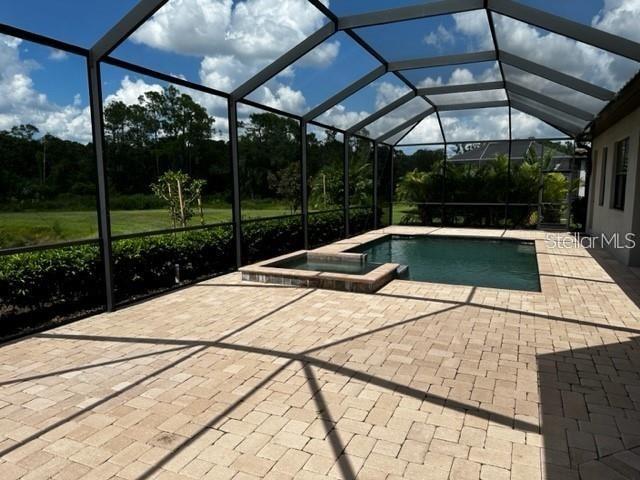 17025 Polo Trail Bradenton, FL 34211 - Photo 19 of 25 a view of a swimming pool with a patio