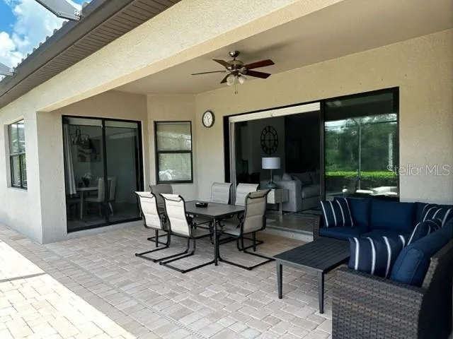 a view of a dining room with furniture window and outside view