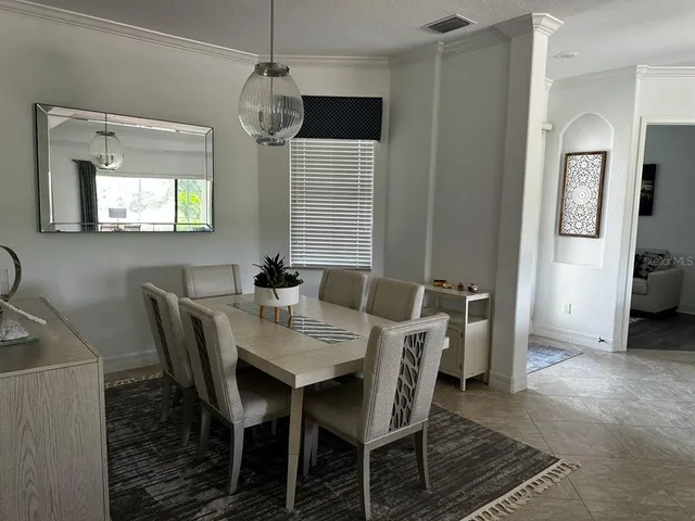 a view of a dining room with furniture