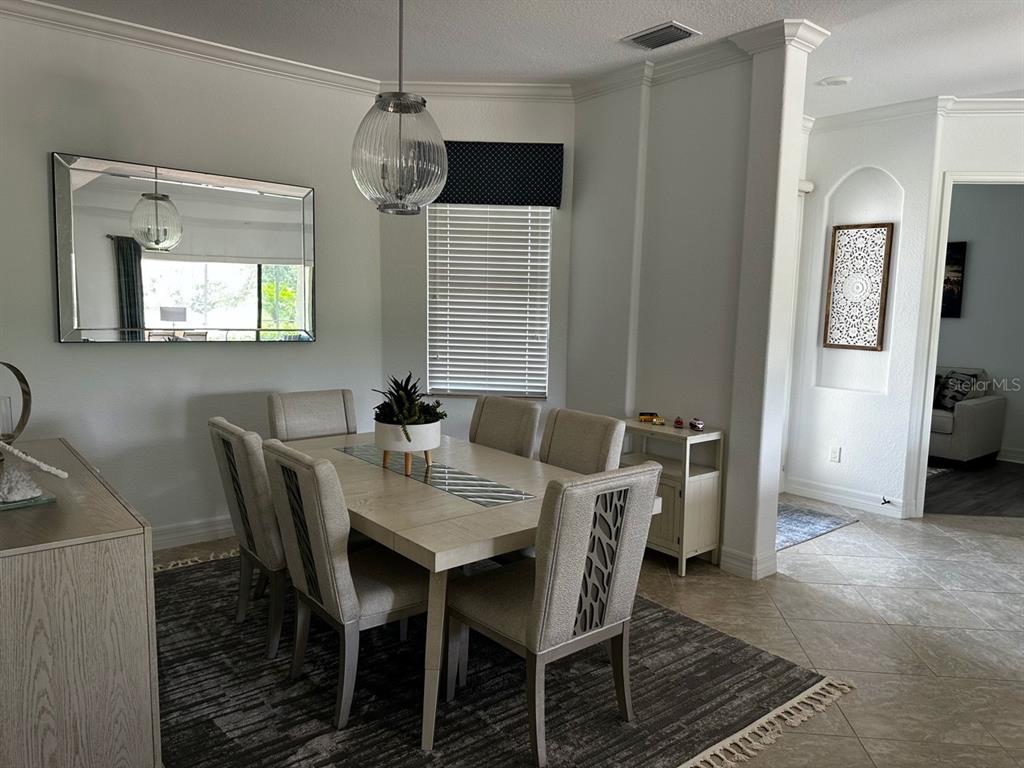 17025 Polo Trail Bradenton, FL 34211 - Photo 4 of 25 a view of a dining room with furniture