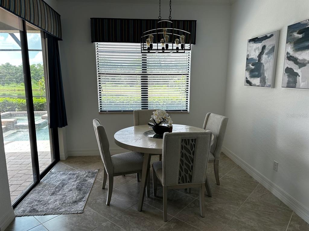 17025 Polo Trail Bradenton, FL 34211 - Photo 5 of 25 a dining room with furniture and window