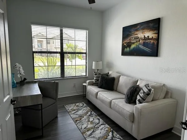 a living room with furniture and a window